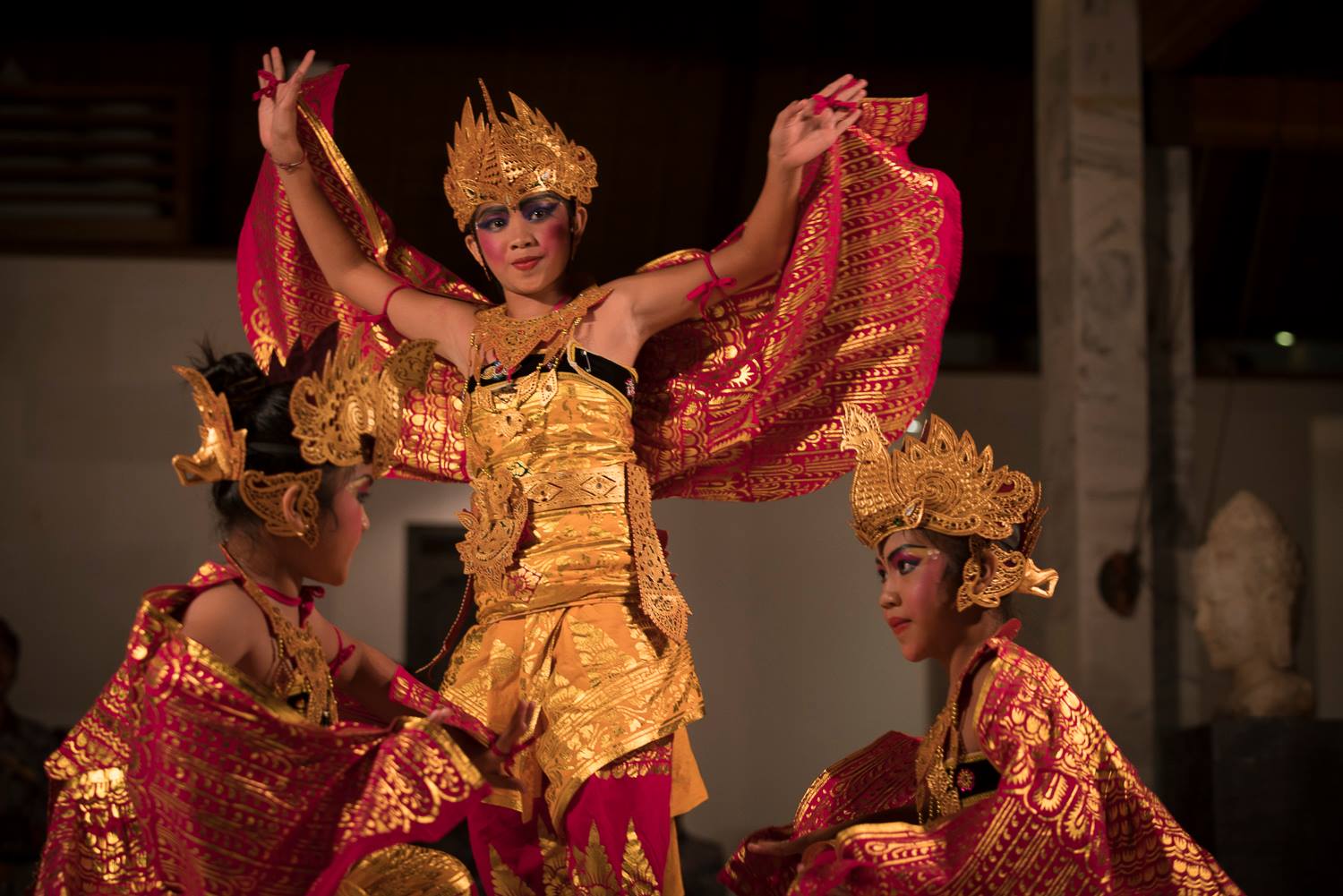 Traditional Balinese dancer in yellow and red costume